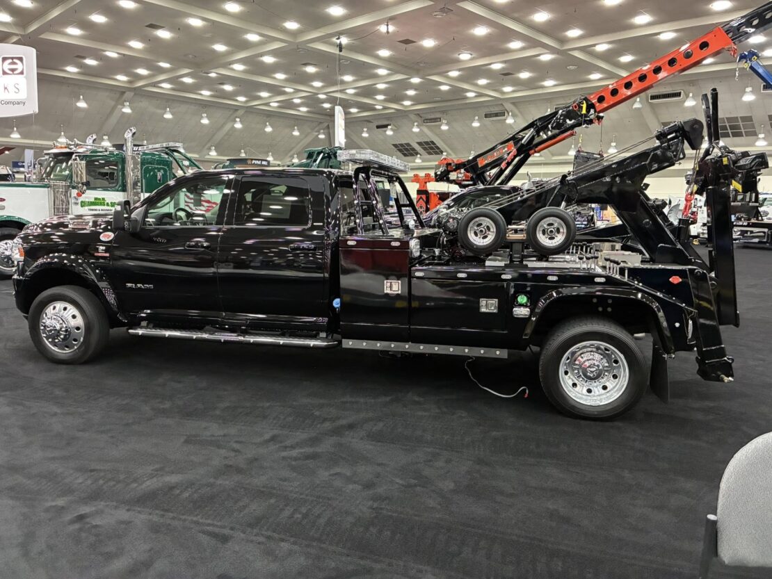 left side angle of a black tow truck at the american towman show in baltimore