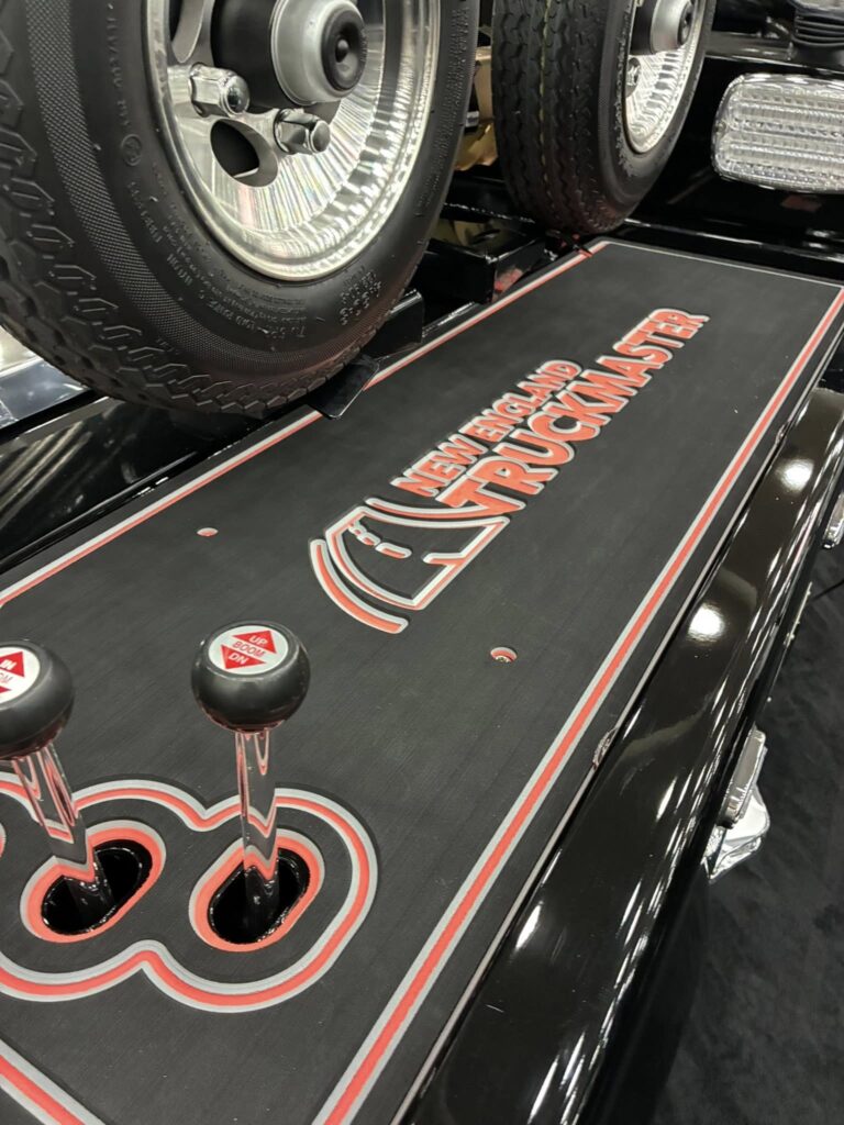 close up of the dolly system on the black tow truck at the american towman show in baltimore