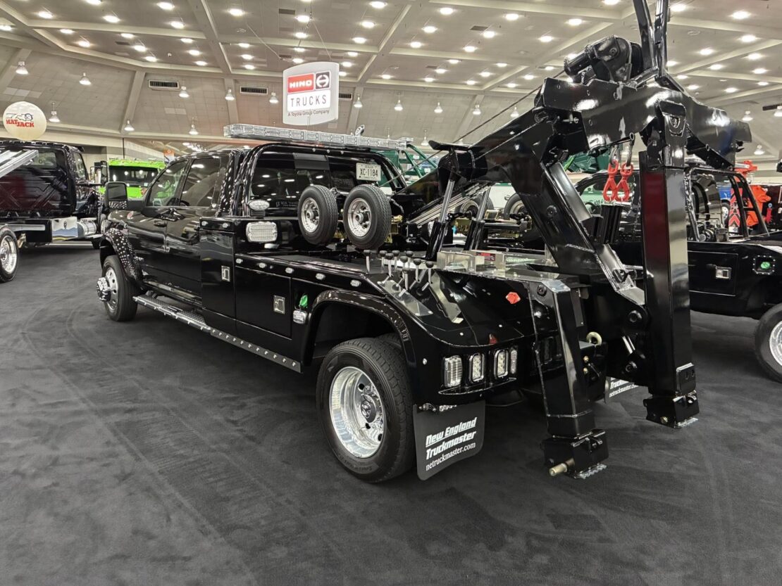 back angle of a black tow truck at the american towman show in baltimore